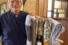 Pastor Joel with Quilts
